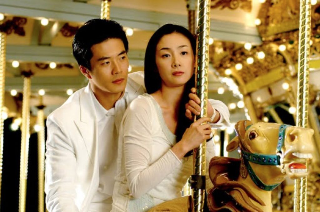 Choi Ji-woo and Cha Song-joo riding carousel