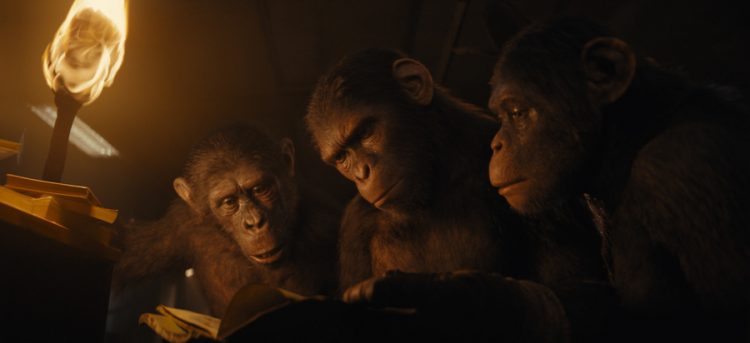 (L-R): Anaya (played by Travis Jeffery), Noa (played by Owen Teague), and Soona (played by Lydia Peckham) in 20th Century Studios' KINGDOM OF THE PLANET OF THE APES. Photo courtesy of 20th Century Studios. © 2023 20th Century Studios. All Rights Reserved.